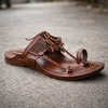 Cross perspective of flexible tanned Kolhapuri footwear for men in Kapashi style, lightweight leather sandal ideal for casual, formal, and ethnic wear.