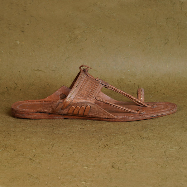 Side angle view men’s original Aamdar Kapashi Kolhapuri chappal Moja shape leather sandal, handcrafted braided upper traditional ethnic breathable durable artisan footwear.