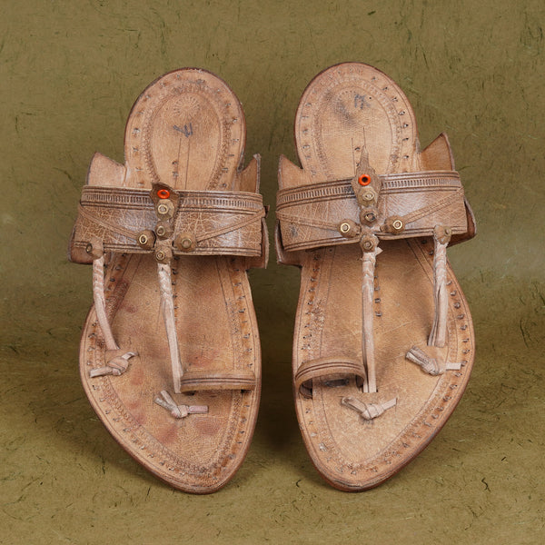 Top angle view men’s original Kurundwadi Kolhapuri chappal leather sandal slipper, overhead handcrafted simple belt traditional ethnic lightweight comfortable organic footwear.