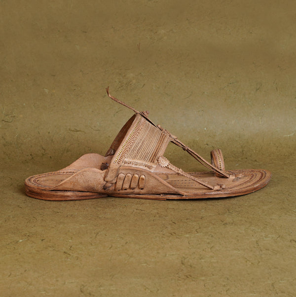 Profile angle authentic premium Kapashi style men’s Kolhapuri leather sandal, intricate weave detailing traditional comfortable luxury organic artistry.