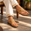 Person wearing SHOPKOP Cork Kolhapuri chappals, showcasing traditional Kolhapuri leather footwear reimagined with a contemporary cork base for modern everyday style.