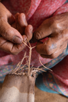 Woman artisan crafting traditional Kolhapuri chappal in Kolhapur