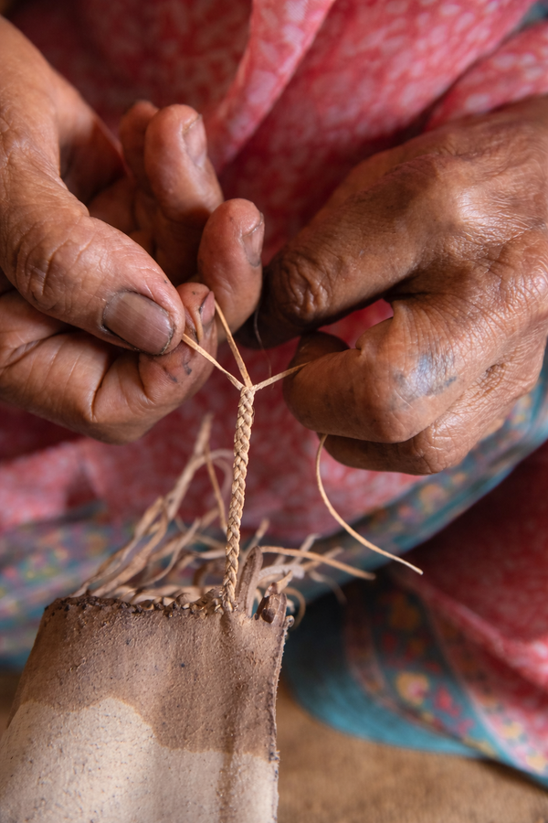 Woman artisan crafting traditional Kolhapuri chappal in Kolhapur