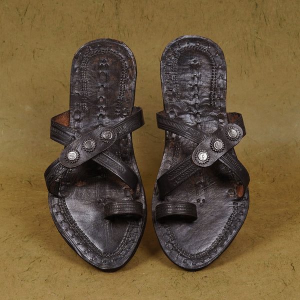 Top angle view women’s original Kisabai Kolhapuri Chepali chappal, overhead handcrafted cross-belt leather traditional ethnic graceful footwear.