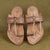Top angle view men’s original Kurundwadi Kolhapuri chappal leather sandal slipper, overhead handcrafted simple belt traditional ethnic lightweight comfortable organic footwear.